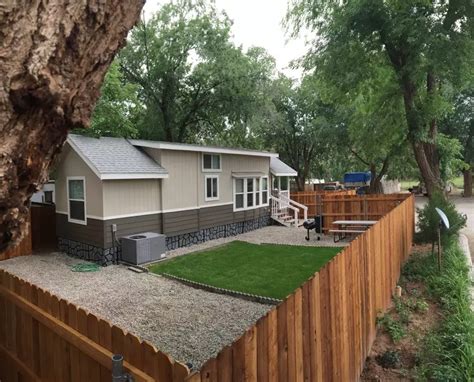 Setting up a cozy nest takes some teamwork. Park Model Tiny Home in Moab, Utah with Fenced-in Backyard