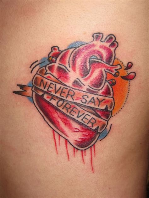 Awesome red and black ink heartbeat tattoo for women wrist. Heart Tattoos Design Ideas Pictures Gallery