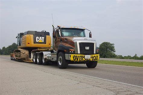 Poindexter Transport Hauling A 349 Cat Excavator In Indiana With A New