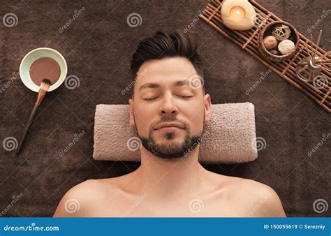 Young Man Relaxing On Massage Table In Spa Salon Stock Image Image Of Bowl Beauty 150055619
