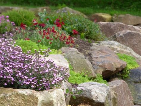 Creating Beauty And Structure With A Rock Wall Garden Garden Therapy