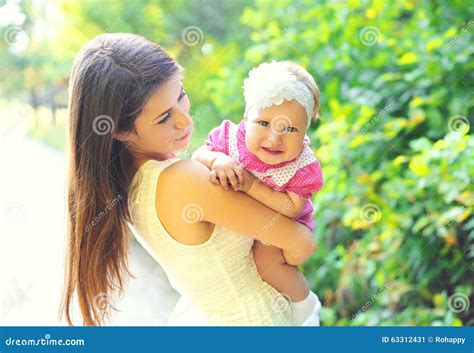 Portrait Happy Smiling Mother And Baby Together In Summer Stock Image