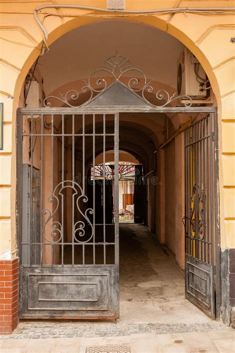 An Old Gate With A Corridor Leading To The Courtyard Of The House Stock