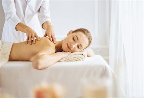 Beautiful Woman Enjoying Back Massage With Closed Eyes Spa Treatment