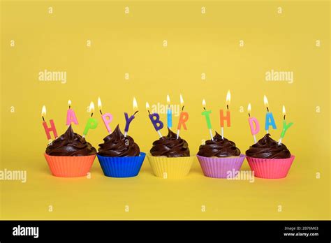 Happy Birthday Cupcakes With Candles Stock Photo Alamy
