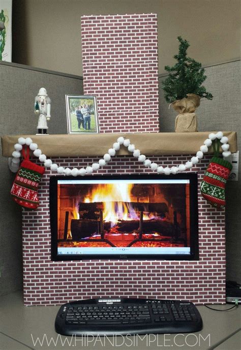 Santa holds a laptop with a greenscreen while sitting in the christmas decorations. Christmas Faux Cardboard Fireplace Mantel for home or ...