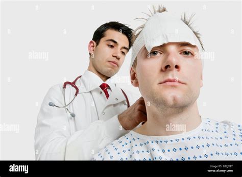 Indian Male Doctor Treating Male Patient Stock Photo Alamy