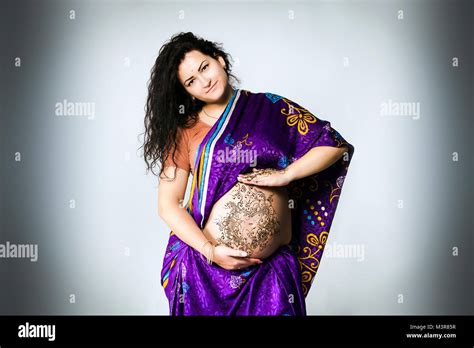 Studio Portrait Of A Pregnant Woman In Indian Sari A Pregnant Belly