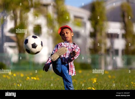 Little Boy Kicking Ball Hi Res Stock Photography And Images Alamy