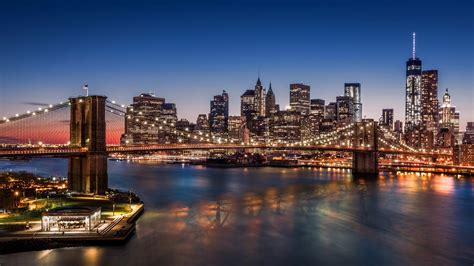 Brooklyn Bridge Against The Backdrop Of New York City At Night