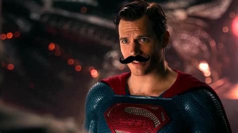 A Man With A Moustache On His Face Wearing A Superman Suit And Mustache