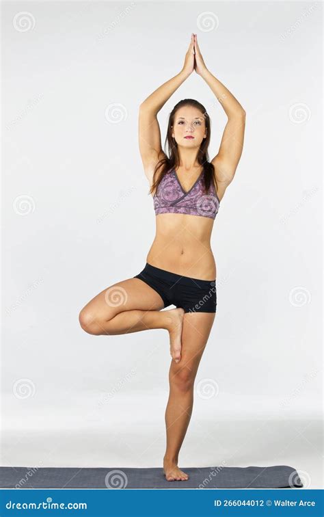 Brunette Yoga Fitness Model Exercises In A Studio Environment Stock