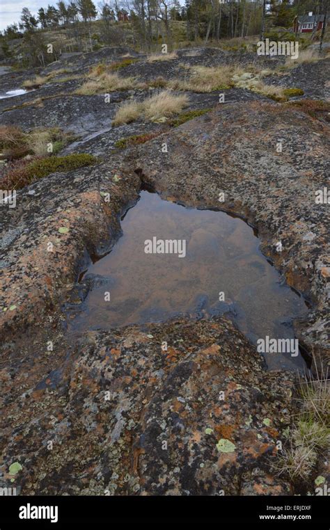 A Puddle Of Water On Rocks Stock Photo Alamy