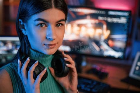 Portrait Of Young Pretty Female Gamer That Is Playing Shooter Neon