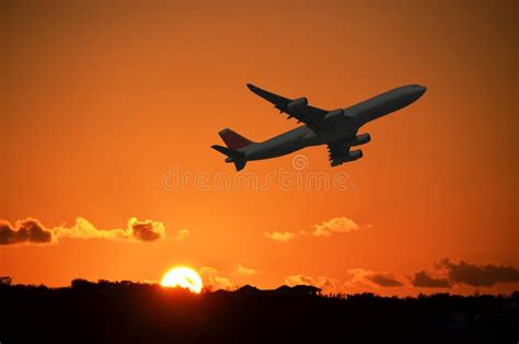 Airplane Take Off Airport In The Evening At Sunset The Sky And