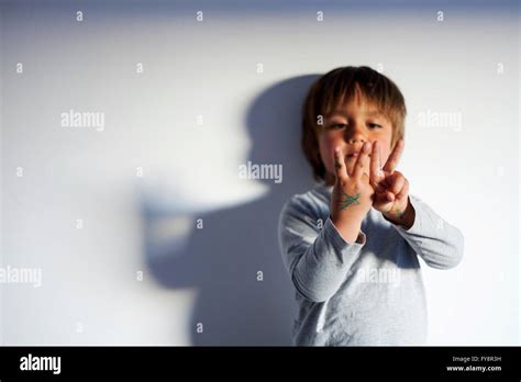 Little Boy Counting With His Fingers Stock Photo Alamy