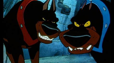 An Animated Image Of Two Black Dogs With Yellow Eyes And Fangs On Their