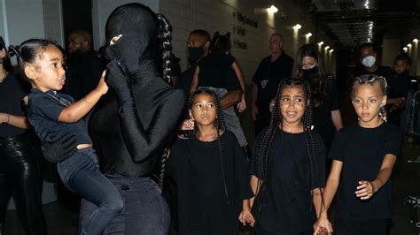 Kim Kardashian, Kanye West twin in masks, avante-garde all-black 