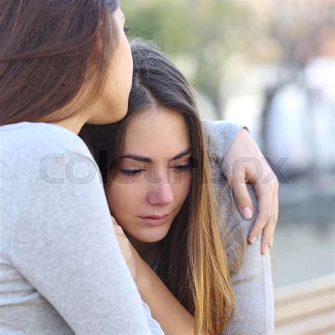 Sad Girl Crying And A Friend Comforting Her Stock Image Colourbox