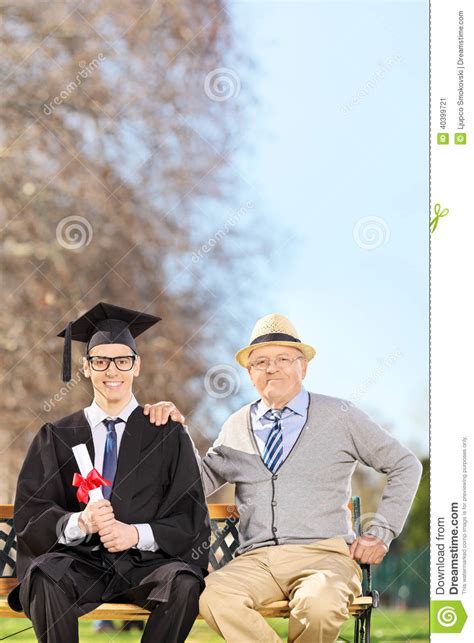 College Graduate Posing With His Father In Park Stock Image Image Of