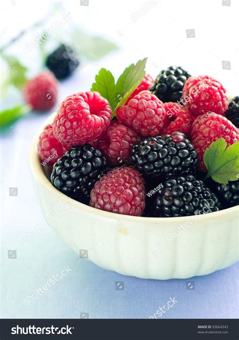 Assorted Berries In Bowl On Natural Background Selectve Focus Stock