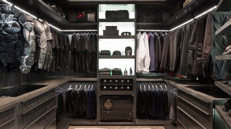 Designed For A Male Client This Walk In Closet Features Dark Cabinetry