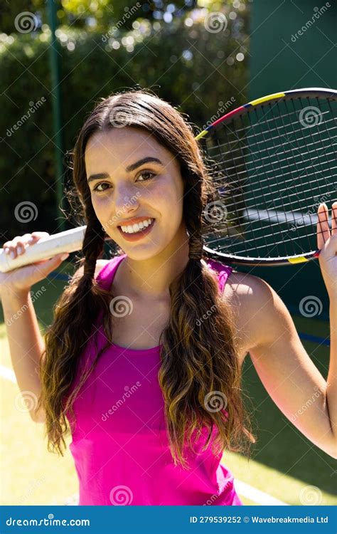 Portrait Of Smiling Biracial Beautiful Woman With Tennis Racket
