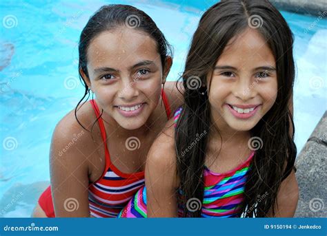 Beautiful Hispanic Sisters By The Pool Stock Images Image 9150194