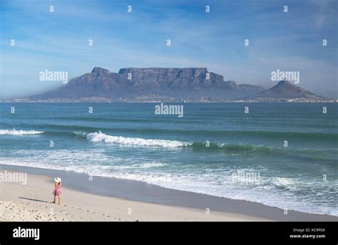 Woman On Bloubergstrand With Table Mountain In The Background Cape