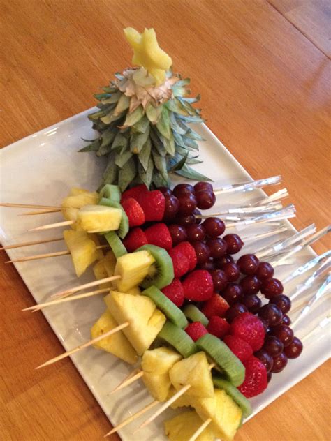 Fruit centerpiece for appetizer table by malinda. Christmas Fruit Kabobs with pineapple tree--cute! | Fruit appetizers, Fruit juice recipes ...
