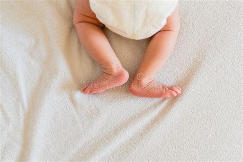 Small Legs And Feet Of Newborn Baby On His Bed Stock Image Image Of
