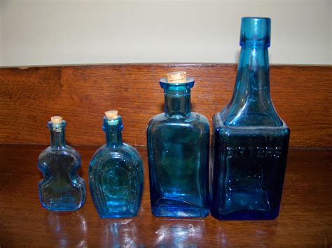 Lot Group Of Four Antique Blue Glass Bottles