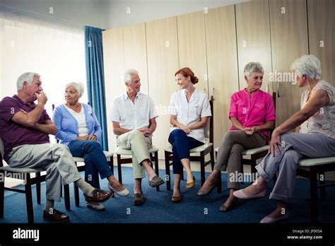 Seniors Interacting With Nurse Stock Photo Alamy