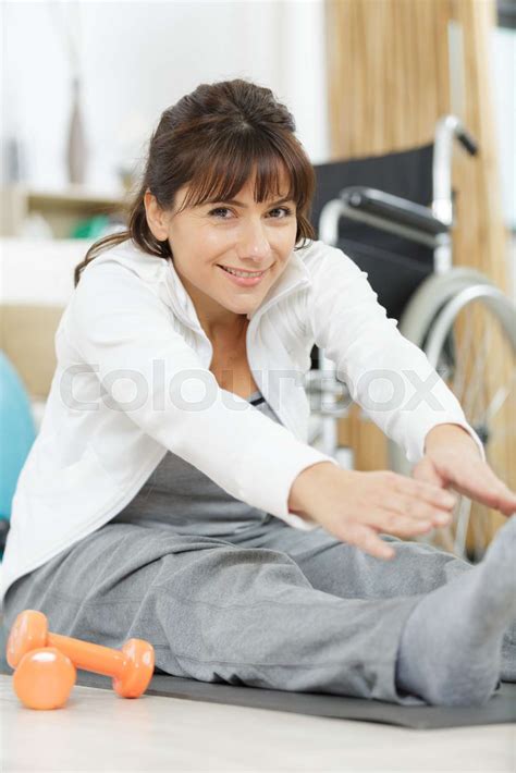 Woman With Paralyzed Legs Doing Rehabilitation Stock Image Colourbox