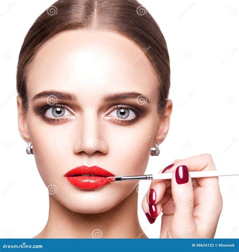 Professional Makeup Artist Applies Makeup For Beautiful Young Woman