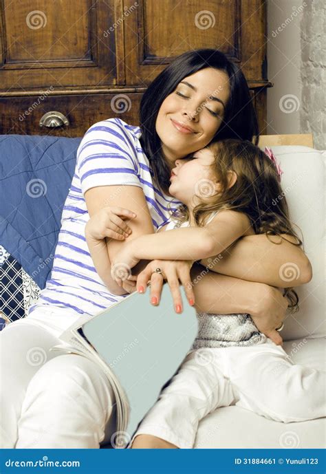 Portrait Of Mother And Daughter Laying In Bed And Smiling Stock Image Image Of Comfortable