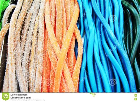 Vivid Licorice Candies With Sugar Background Stock Image
