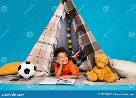 Photo Of Thoughtful Preschool Boy Reading Interesting Book Dreamy