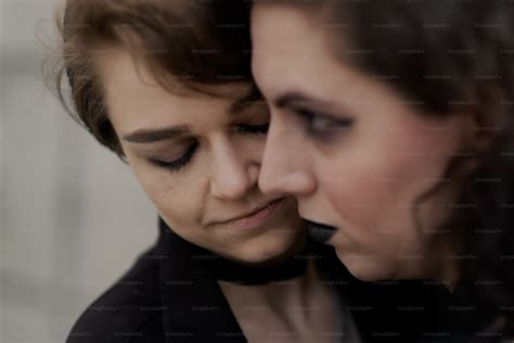 A Close Up Of Two People Touching Each Other Photo Lgbtq Image On Unsplash