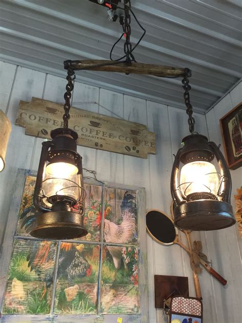 Bad lighting and ugly lamps can really ruin your decor. Hanging light made from old lanterns and a horse yoke ...