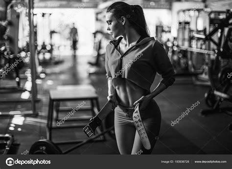 Sexy Fitness Woman In Sport Wear With Perfect Fitness Body Posing In Gym Stock Photo
