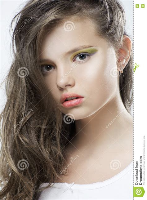 Beauty Portrait Of A Young Girl With Bright Makeup And Long Hair Stock