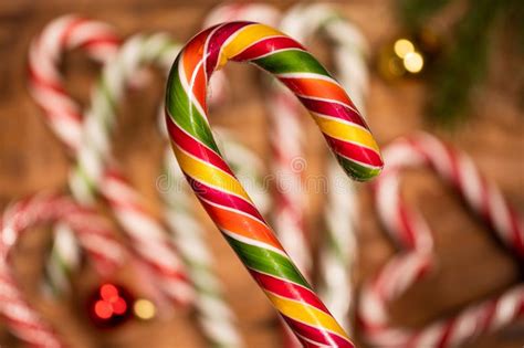 Caramel Sticks And Fir Branches On A Wooden Background Copy Space