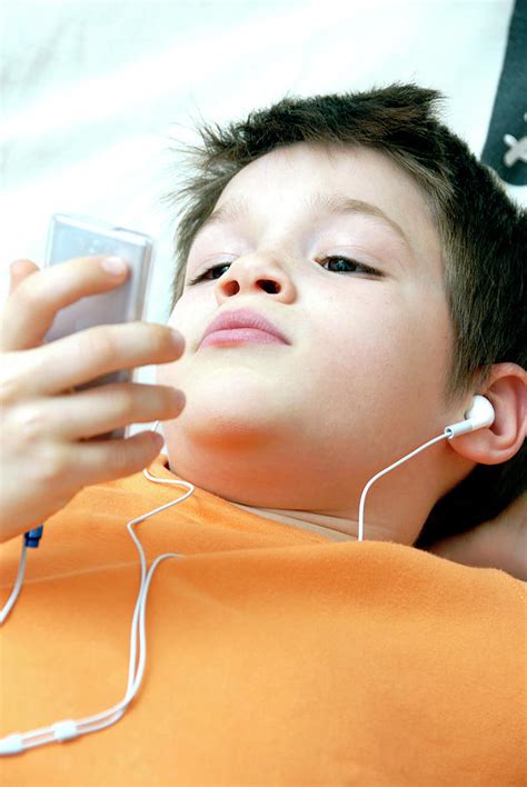 Boy Listening To Music Photograph By Aj Photoscience Photo Library