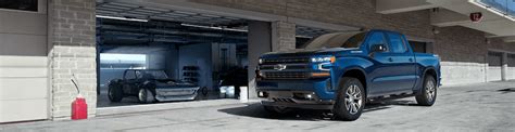 Front Side View Of Chevrolet Silverado Parked In Front Of An