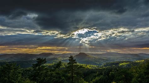 Mountain Landscape Hills With Pine Forest Sunlight Dark Clouds