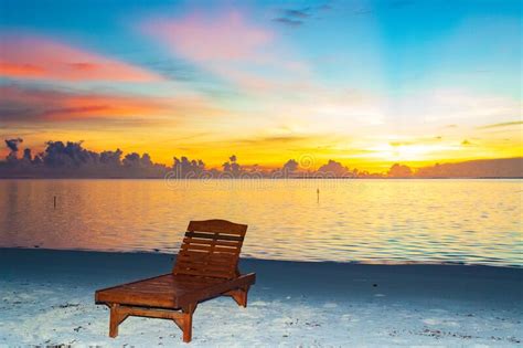 Lonely Sunbed At Sunrise Bodufinolhu Island Maldives Stock Photo