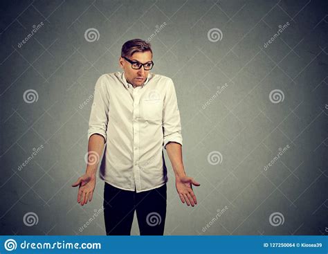 Clueless Young Man Shrugging Shoulders Stock Photo Image Of Fail