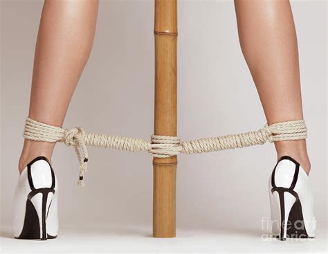 Woman Legs Tied With Ropes To Bamboo Photograph By Maxim Images Prints