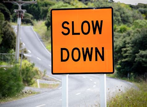 21500 Slow Down Sign Stock Photos Pictures And Royalty Free Images